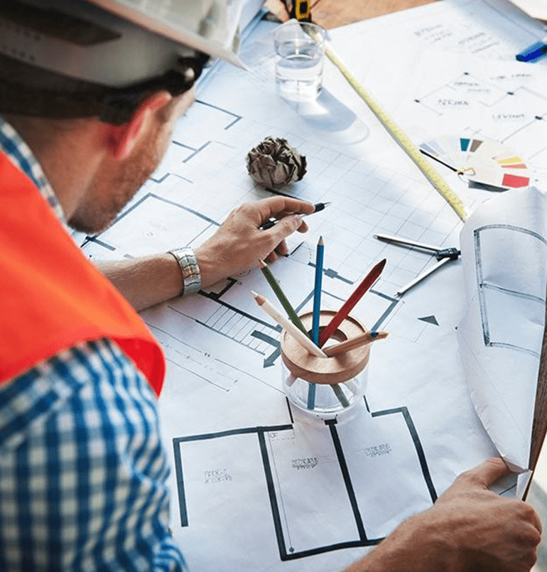 construction worker writing on construction papers